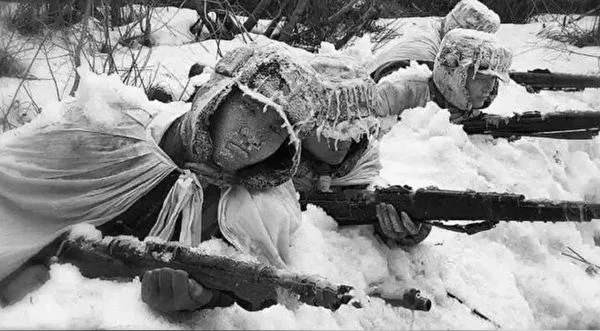 Chinese People’s Volunteer Army soldiers lying frozen in the snow during the Korean War.