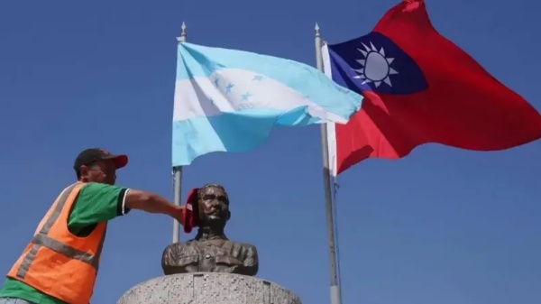 Man with flags of Honduras and Republic of China (Taiwan)