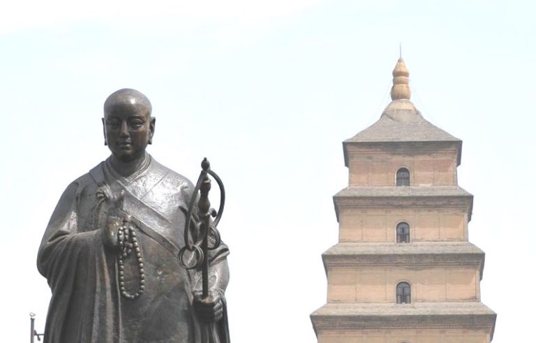 Statue of Chinese Buddhist monk Xuanzang (玄奘) stands before the Wild Goose Pagoda in Xi'an, China.